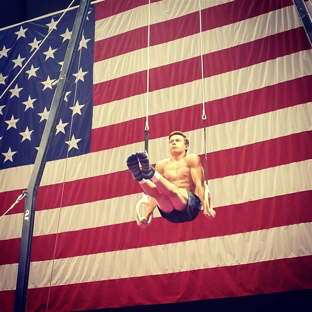 Brody Malone holding an American flag